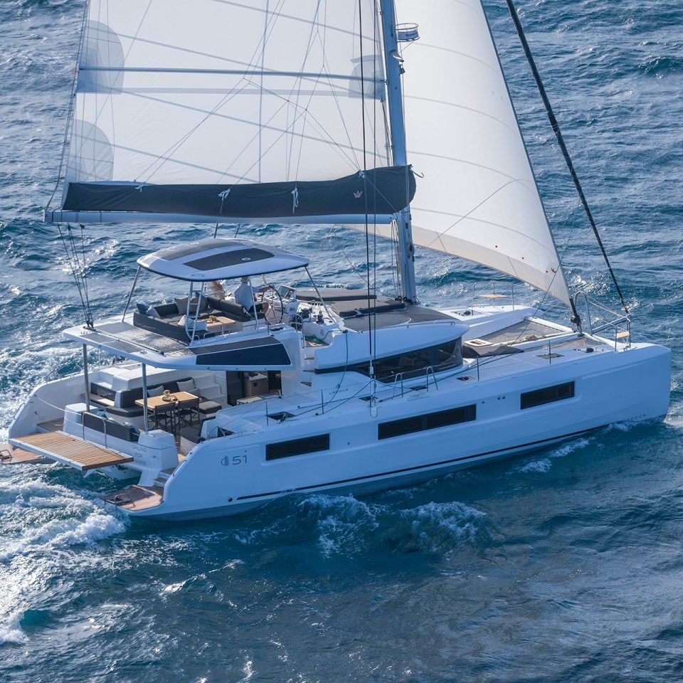 Friends sailing luxury Lagoon 51 yacht