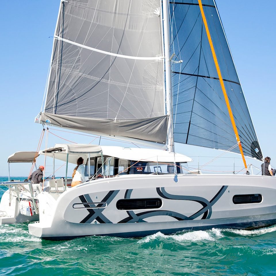 Sailing Excess 11 catamaran sailboat with people aboard