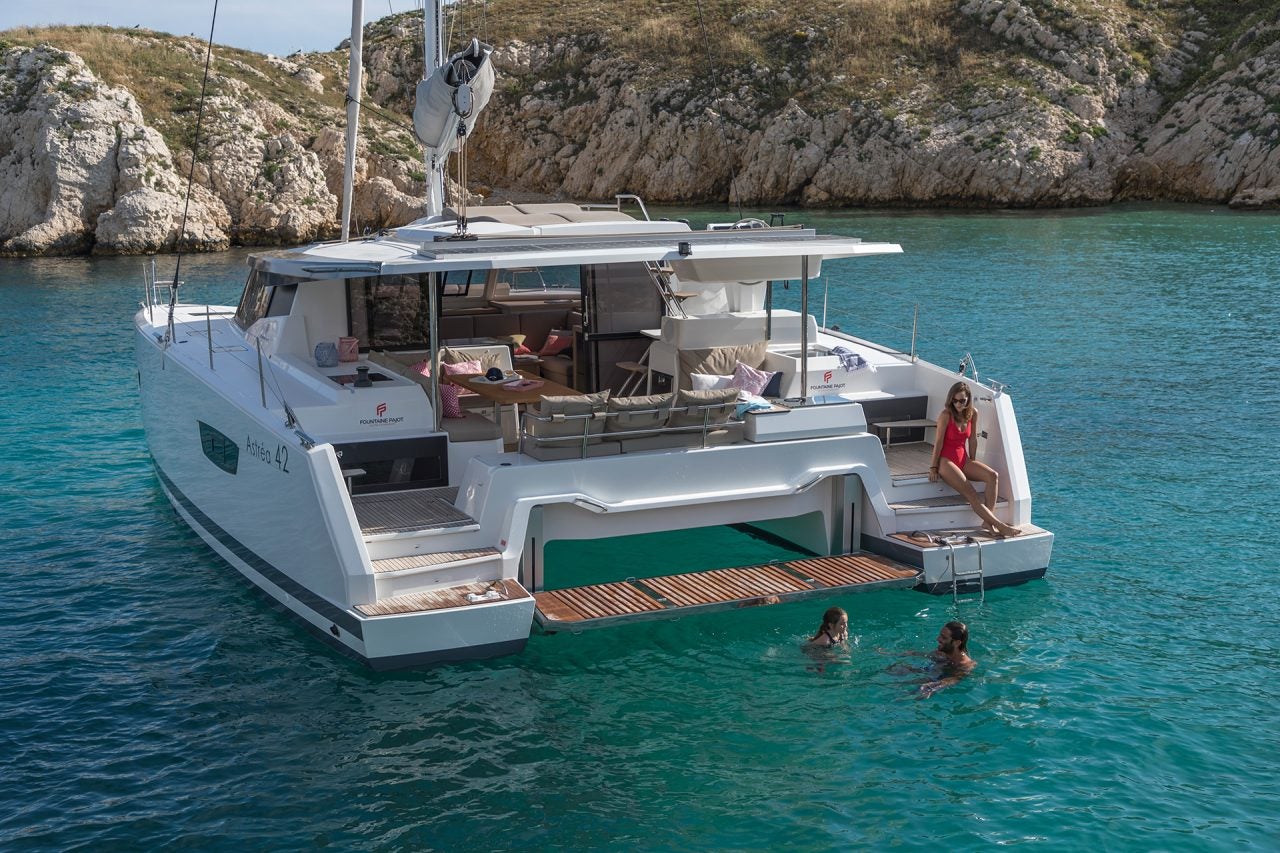 Fountaine Pajot Astrea 42 yacht at anchor with family enjoying the water