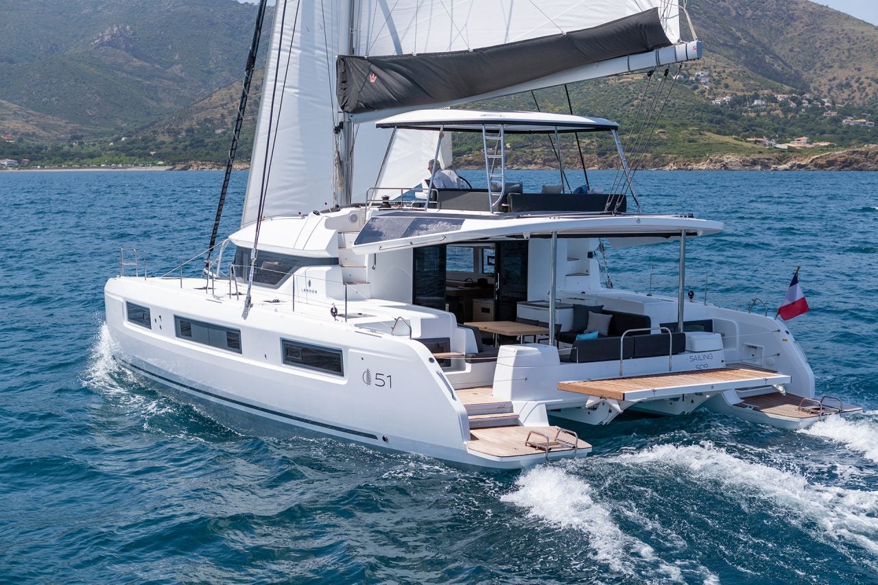 Man sailing luxury Lagoon 51 yacht