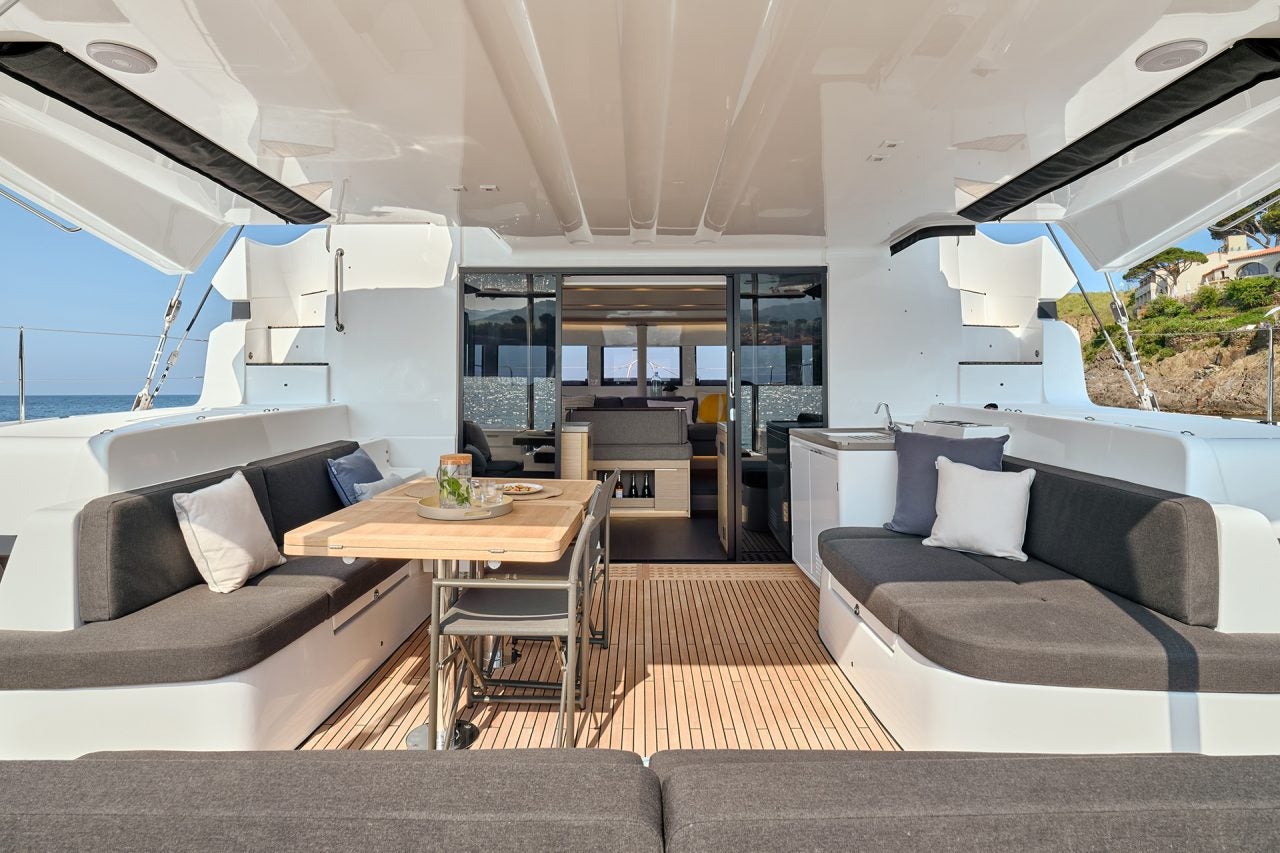 Exterior cockpit dining area on Lagoon 51 catamaran sailboat