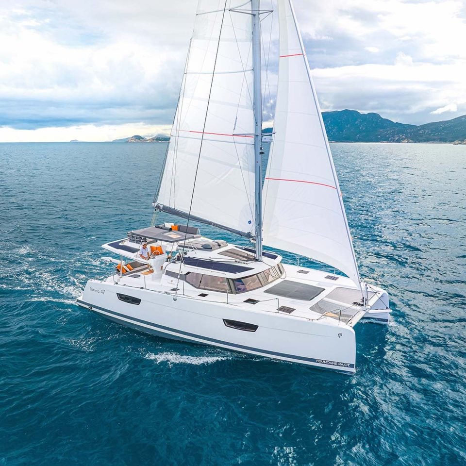 Fountaine Pajot Tanna 47 catamaran cruising with sails up