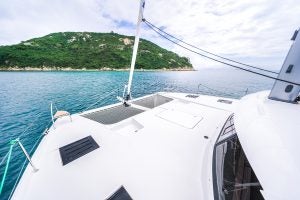 View over front deck of the Tanna 47 catamaran to island is distance