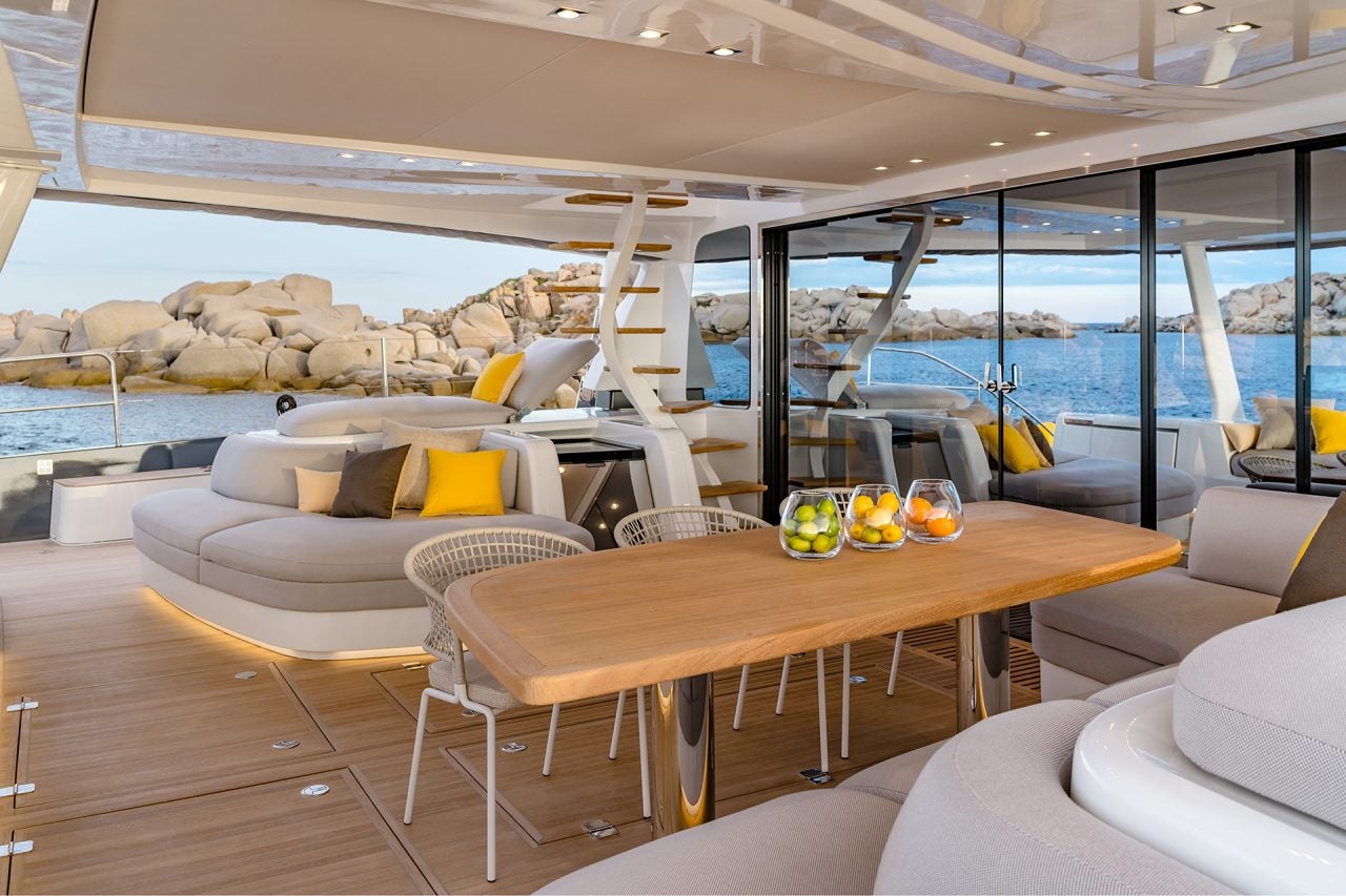 Wide view of the cockpit seating area of the Lagoon 77 catamaran