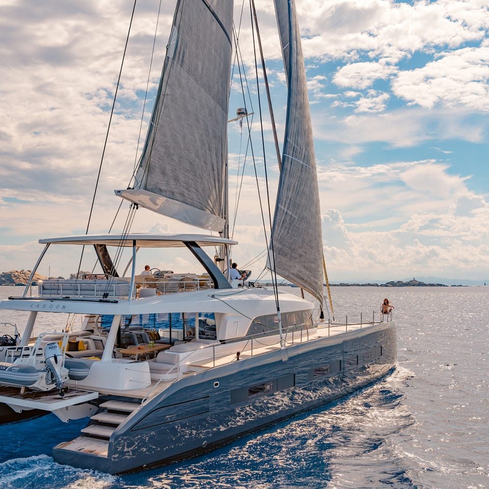 Lagoon 77 luxury catamaran cruising with sails up