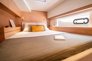 Cabin berth with light wood finishes on the Bali 4.4