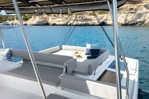 Bali 4.6 flybridge lounge with cushioned seating and sunbed