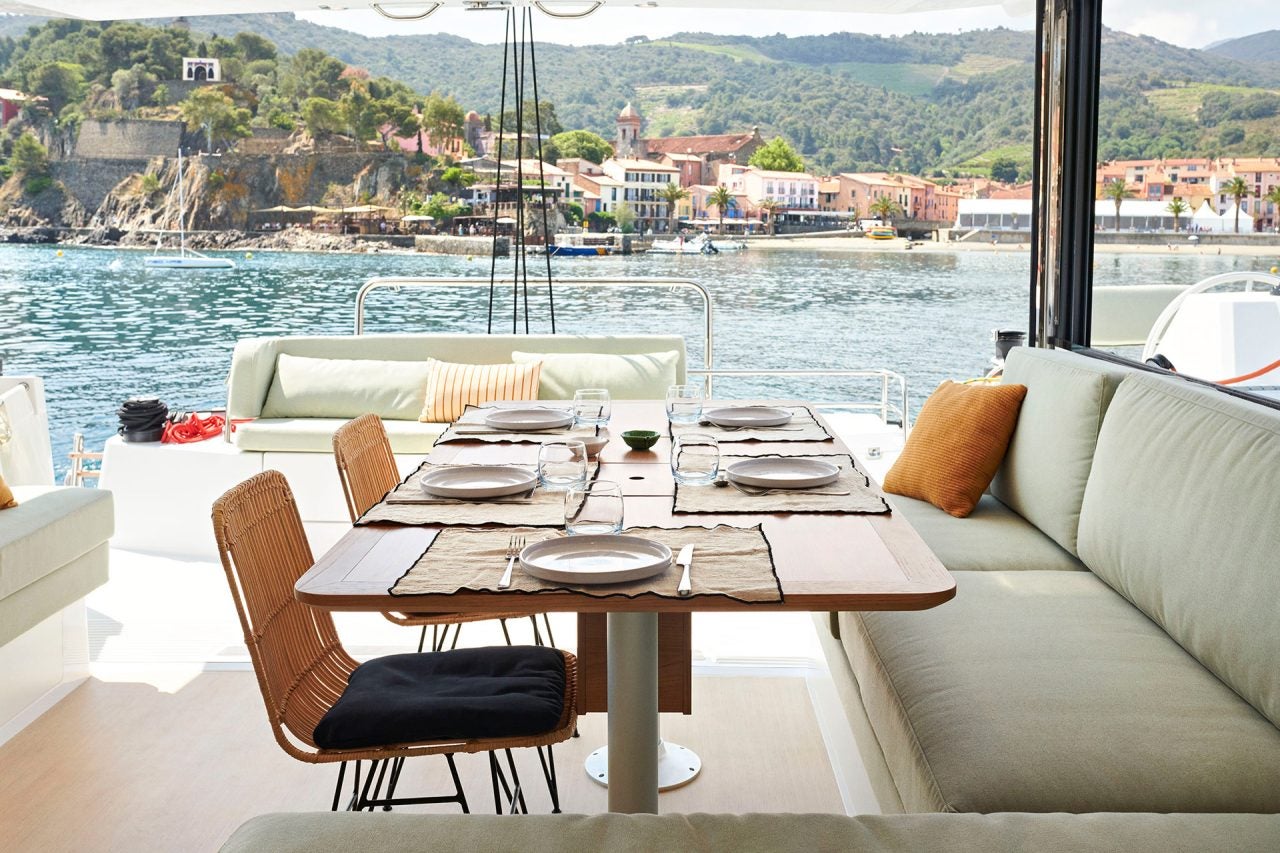 Transom bench seating on the Bali Catsmart catamaran with seaside town view