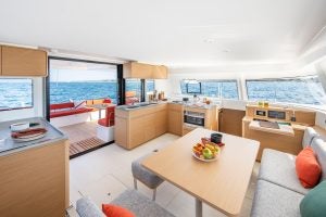 Wide angle view of the Excess 14 sailing catamaran salon interior