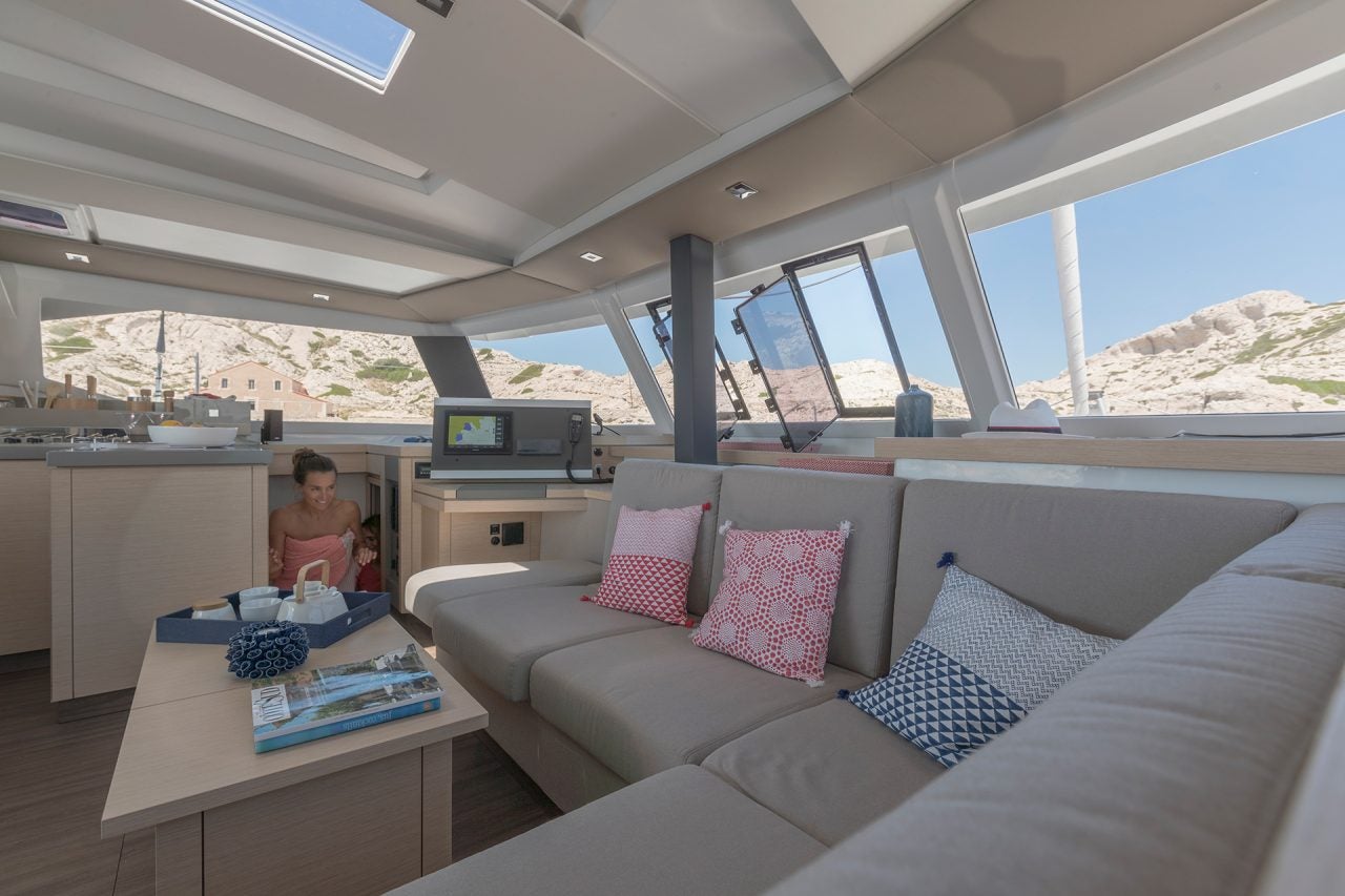 Fountaine Pajot 67 catamaran salon lounge area with wrap windows