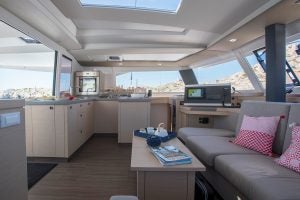 Fountaine Pajot  67 catamaran salon lounge area with wrap windows