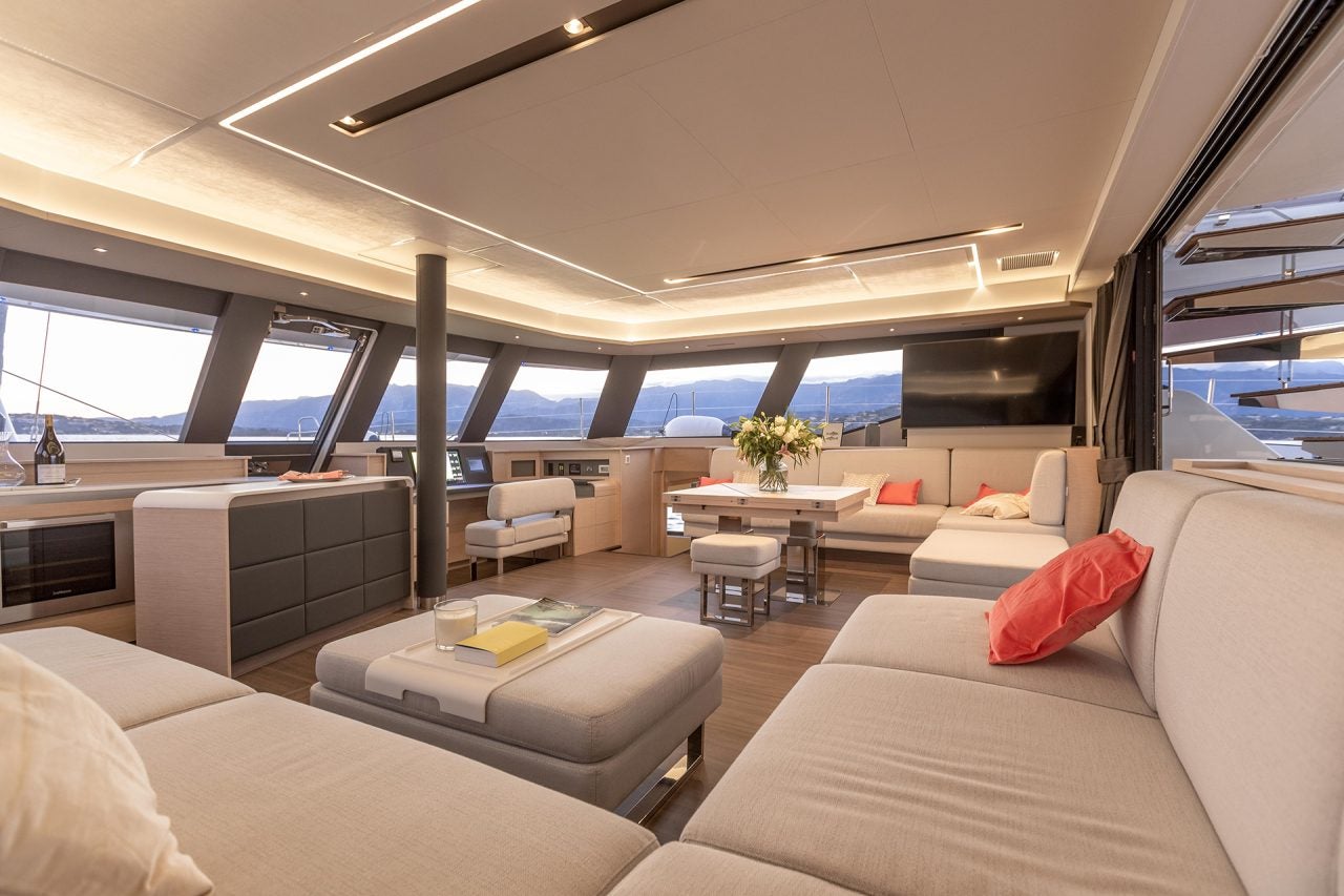 Cockpit with dining table aboard the Fountaine Pajot  67 catamaran