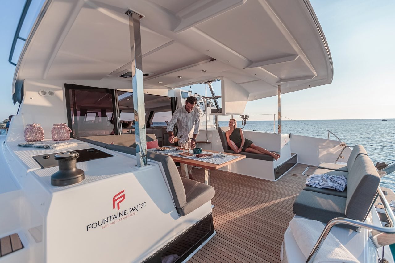 People in cockpit of Fountaine Pajot luxury yacht model