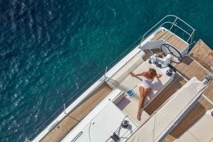 Woman lounging in cockpit on the Jeanneau Sun Odyssey 490 sailboat