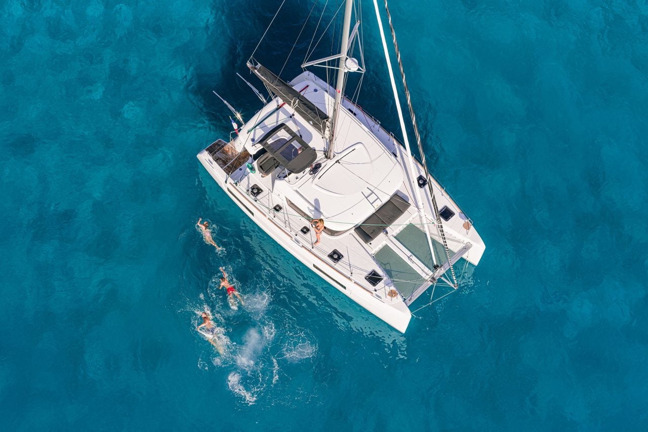 Aerial view of Lagoon 40 sailing catamaran at anchor