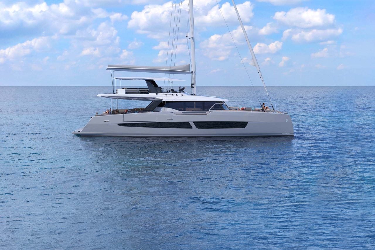 Side view of the Thira 80 catamaran at anchor